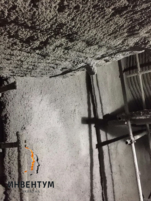 Gunite-concrete after drawing on vertical and horizontal parts of a boiler
